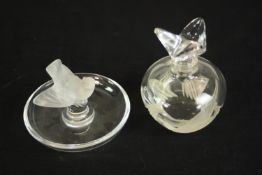 A Lalique pin and ring holder, in the form of a frosted songbird with circular base etched,