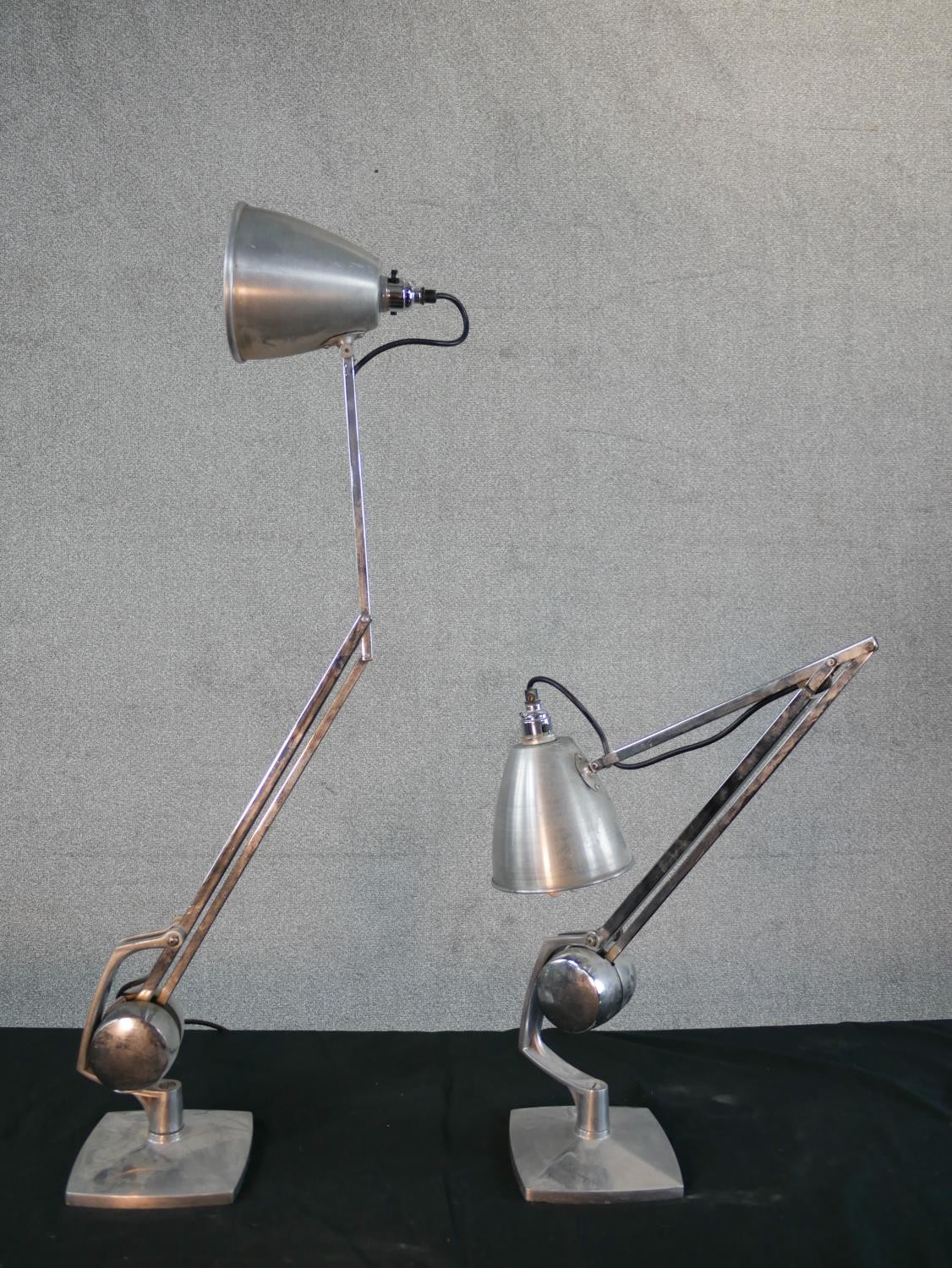 A Pair of brushed steel angle poise lamps, raised on square plinth base. H.49 W.36cm - Image 6 of 6