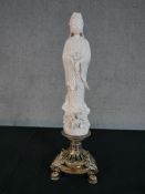 A Chinese porcelain Blanc de Chine figure of Guan Yin standing on pierced silver plated stand raised