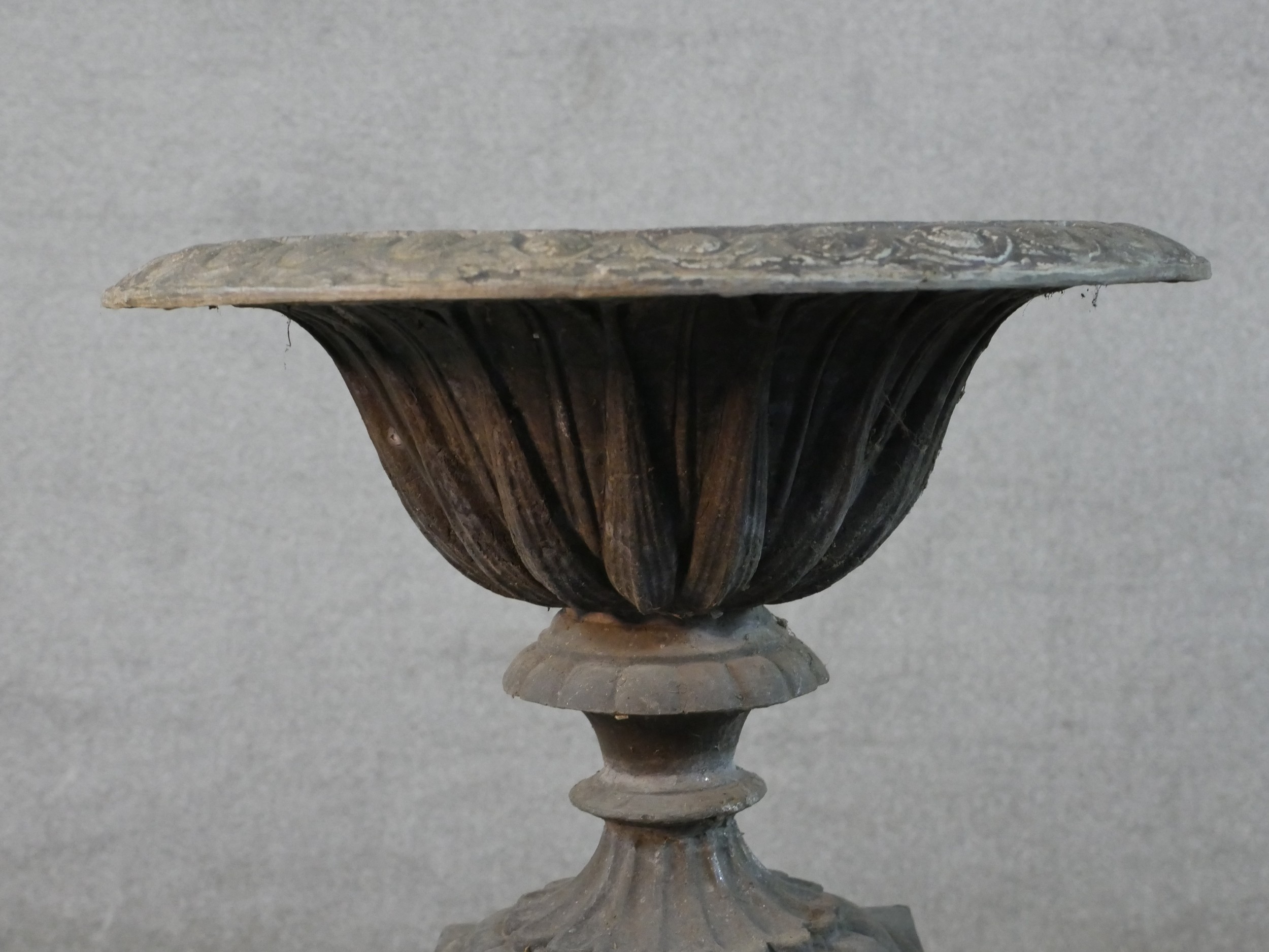 A 19th century fluted lead garden urn on turned central column terminating in square foot raised - Image 2 of 4