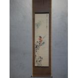 A Japanese scroll with floral and bamboo design and character inscription with red artist's seal.