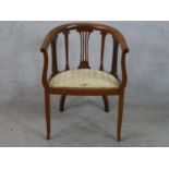 Edwardian mahogany framed open arm bow back chair raised on square tapering supports terminating