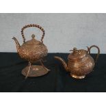 Two Indian repousse copper serpent design kettles one on stand. H.27 W.22 D.18cm Largest