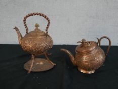 Two Indian repousse copper serpent design kettles one on stand. H.27 W.22 D.18cm Largest