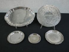 A collection of silver plate trays and place mats along with an engraved Danish silver mint tray