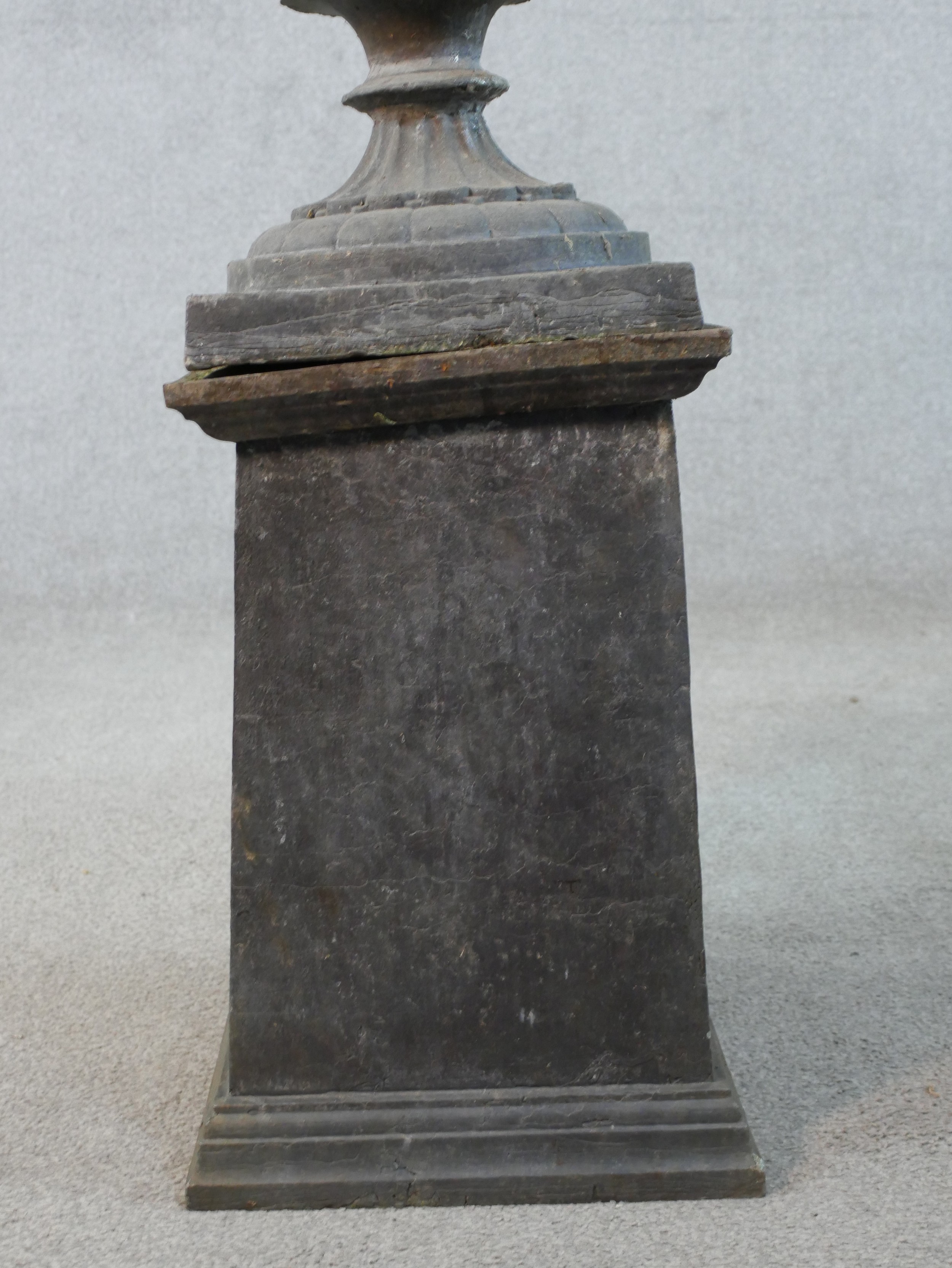 A 19th century fluted lead garden urn on turned central column terminating in square foot raised - Image 4 of 4