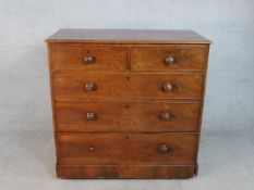 A Victorian mahogany chest of two short over three long graduated drawers with knob handles, on a