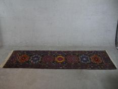 A blue ground hand made Kazak Russian runner. W.275 D.75cm