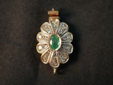 A Victorian yellow metal (tested as 9ct) rose cut diamond and emerald floral design clasp. Set to