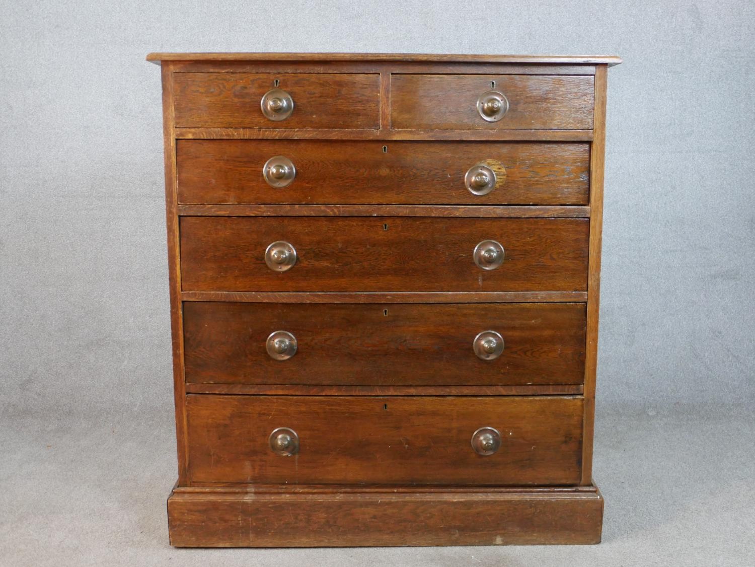 An Edwardian mahogany chest of two short over four graduating drawers, raised on plinth base. H.