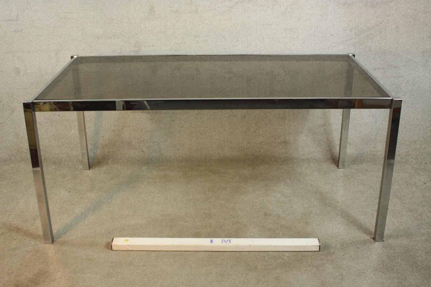 A 1970's dining table with a smoked plate glass top on a square section tubular chrome frame. H.74 - Image 2 of 7
