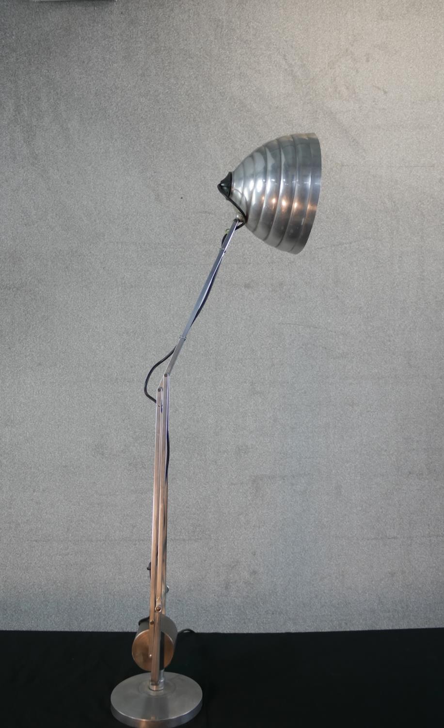 A brushed steel electric desk top angle poise style lamp, on circular foot. H.67 W.58cm - Image 5 of 7