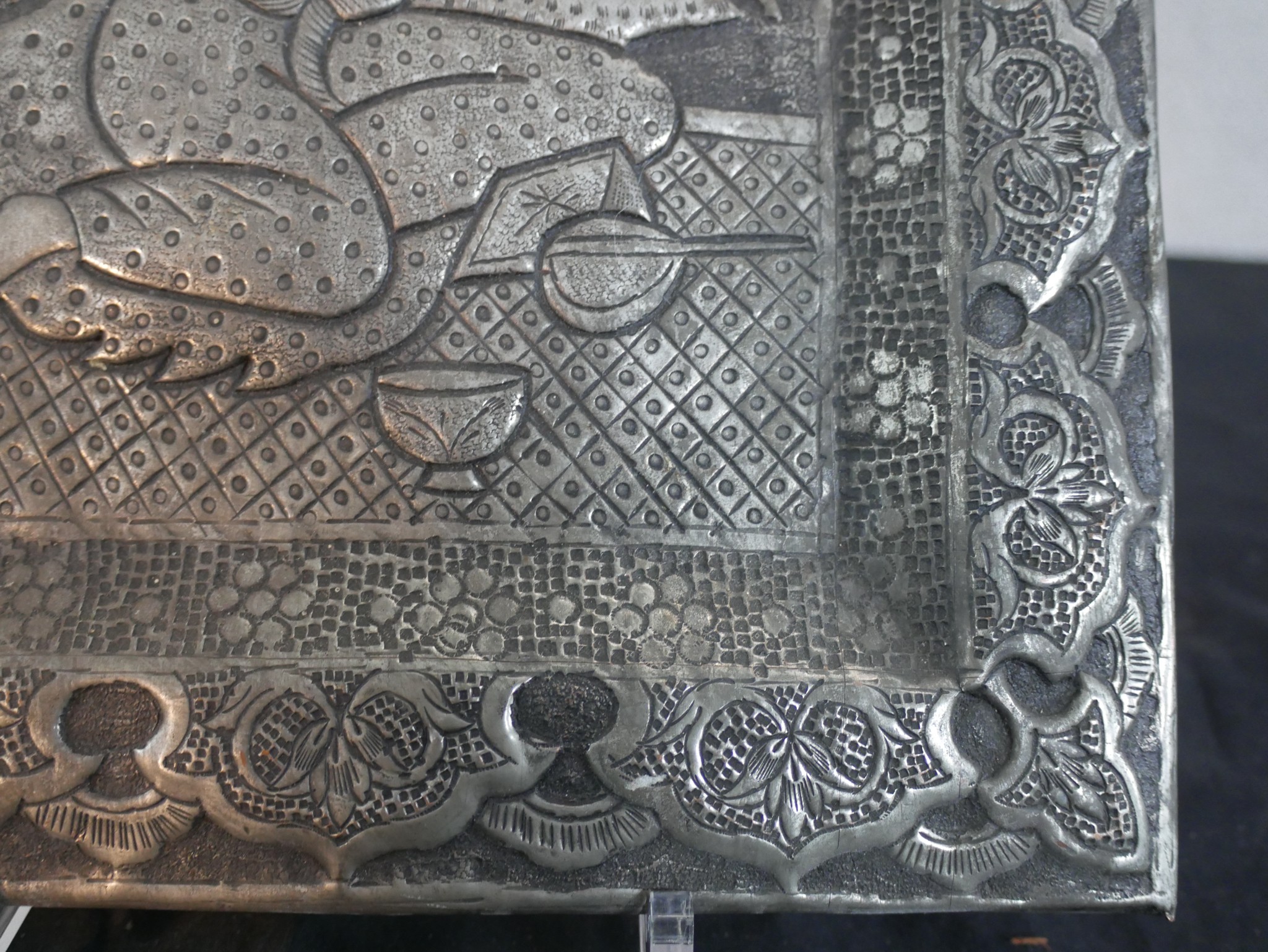 A repousse middle eastern silvered plaque with wedding scene of female handing seated male a glass - Image 3 of 4