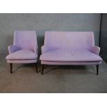 A contemporary mid 20th century Designers Guild sofa and armchair, upholstered in purple fabric