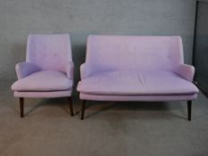 A contemporary mid 20th century Designers Guild sofa and armchair, upholstered in purple fabric
