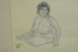 A framed and glazed watercolour of a seated nude female, signed and with artist's stamp. H.54 W.