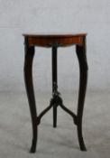 A 20th century mahogany and brass mounted occassional table / jardinere stand with geometric