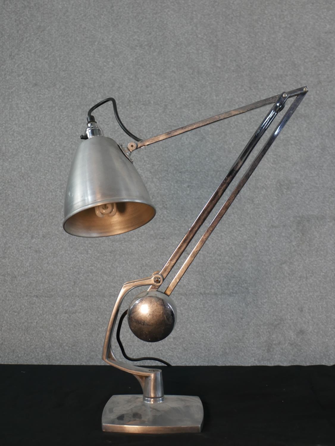 A Pair of brushed steel angle poise lamps, raised on square plinth base. H.49 W.36cm - Image 2 of 6