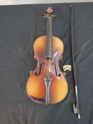 A cased early 20th century 3/4 violin with hardwood bow with mother of pearl