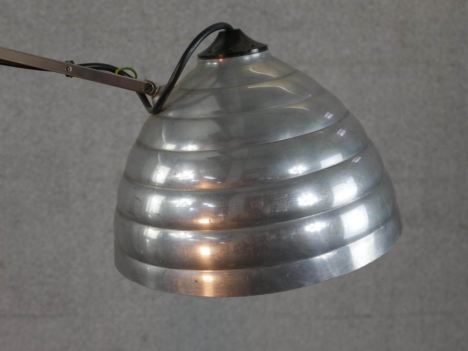 A brushed steel electric desk top angle poise style lamp, on circular foot. H.67 W.58cm - Image 2 of 7