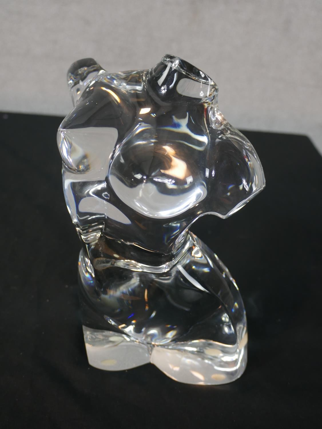 A Baccarat crystal sculpture of a nude female torso. Stamped to base. H.25 W.15 D.12cm