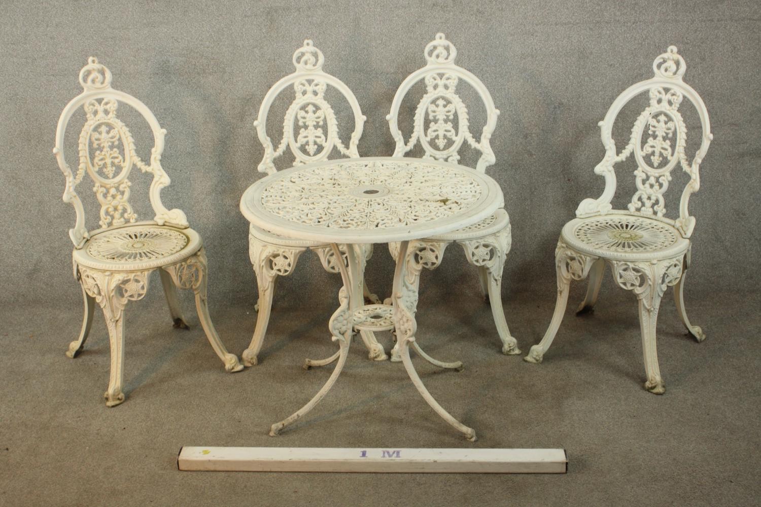 A Victorian style white painted wrought iron garden set comprising of matching four chairs and a - Image 2 of 10