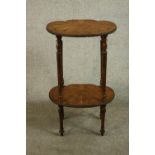 A 20th century Italian or French marquetry inlaid side table, the top and undertier of shell form,