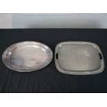 A hammered pewter twin handled tray with another oval silver plated. H.36 W.47cm Largest
