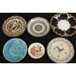 A collection of six ceramic plates, including a lustre ware platter with bird and foliate design,
