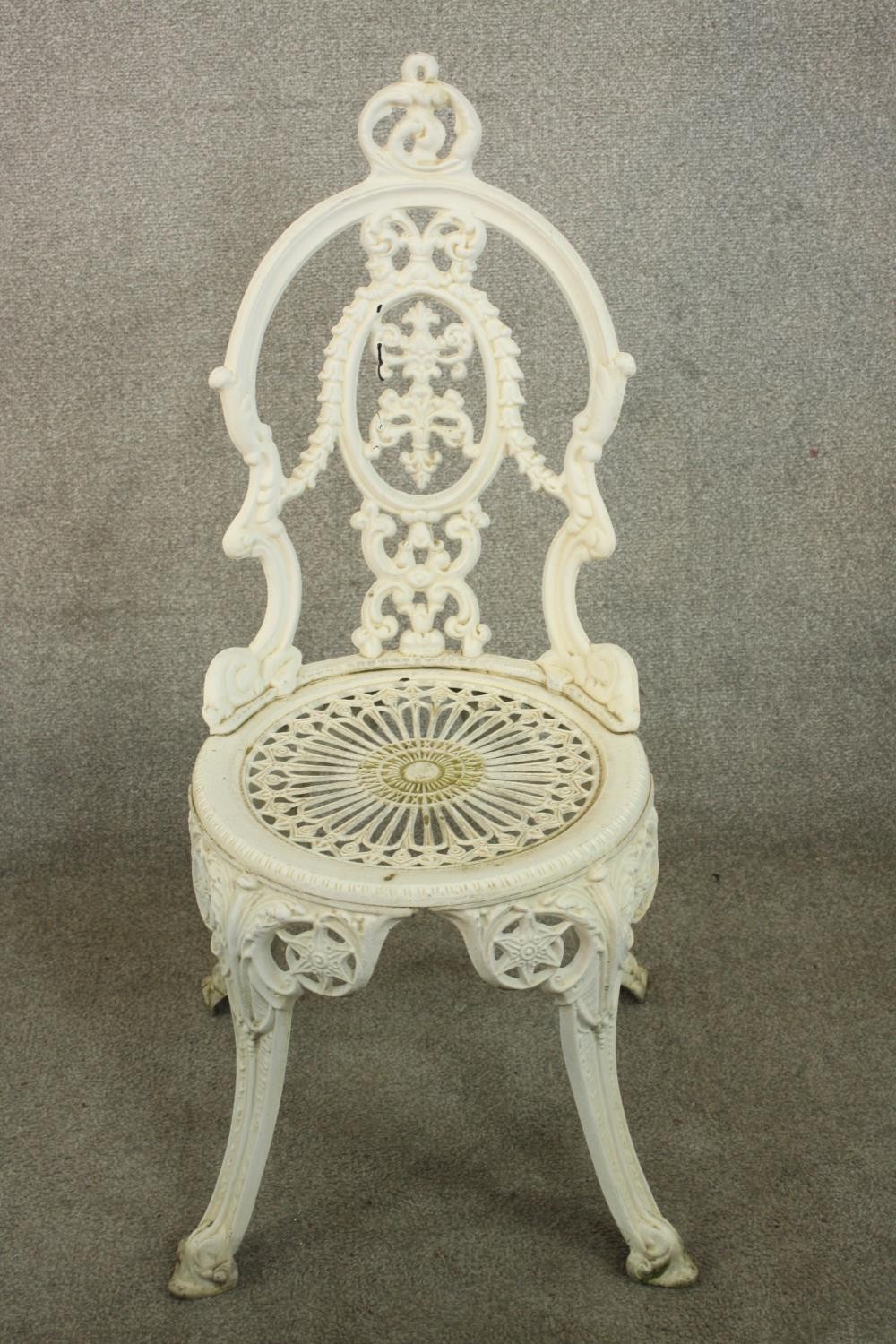 A Victorian style white painted wrought iron garden set comprising of matching four chairs and a - Image 5 of 10