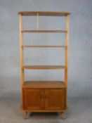 A 20th century Ercol blonde elm and beach Giraffe room divider, model 363, with adjustable shelves