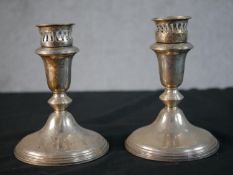 A pair of sterling silver weighted candlesticks with pierced galleries. Stamped Sterling, 925. H.