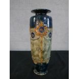 A Royal Doulton stoneware Art Nouveau vase, decorated with stylised flowers, numbered to the base