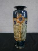 A Royal Doulton stoneware Art Nouveau vase, decorated with stylised flowers, numbered to the base