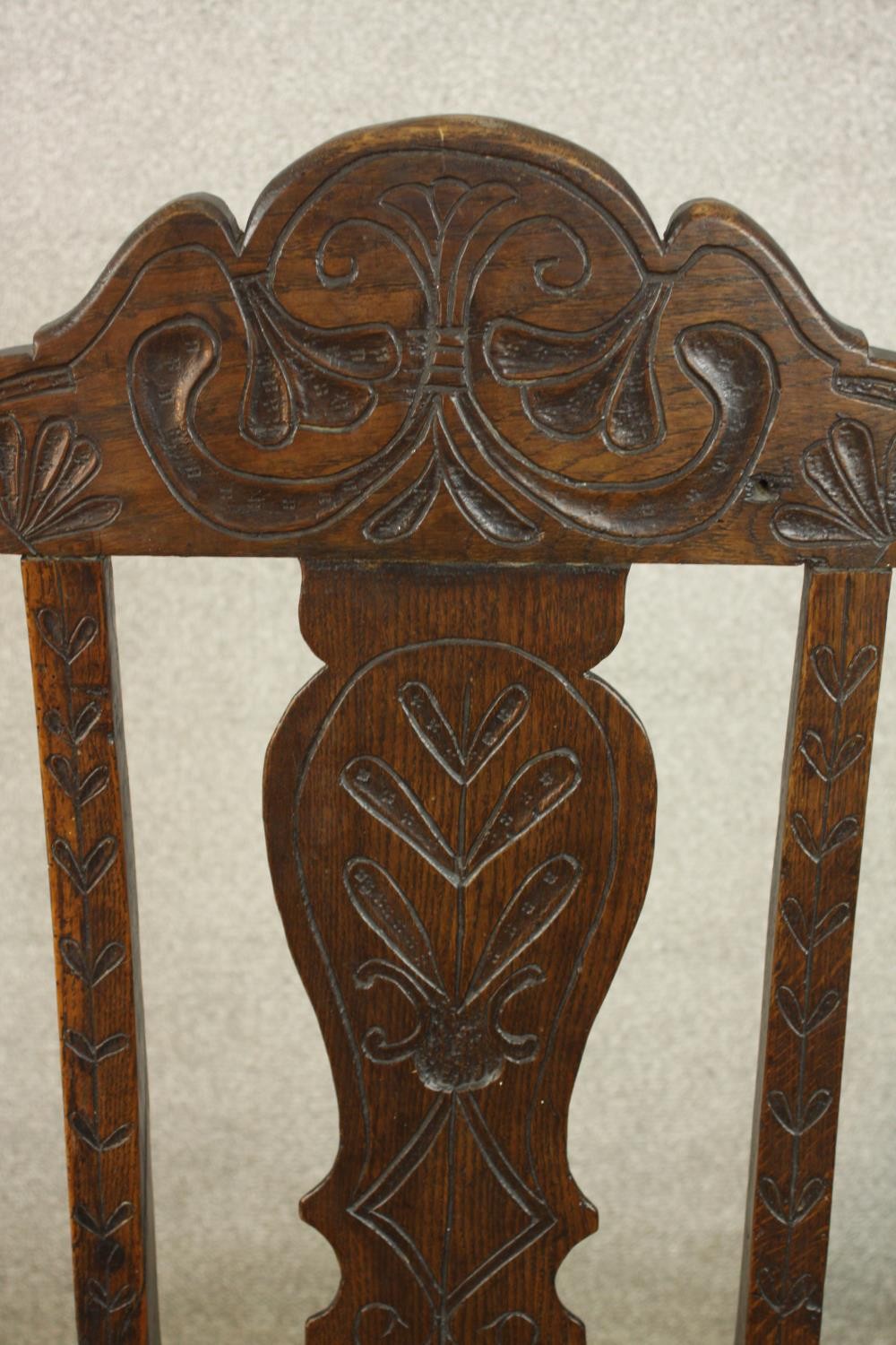 A 19th / early 20th century carved oak hall chair, with carved rail and splat back raised on - Image 6 of 6