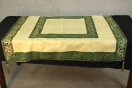 A silk embroidered table cloth/runner with tassels to the corners. L.122 W.124cm.