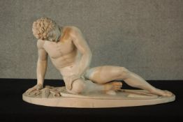 A 20th century carved resin figure of a male nude warrior, The Dying Gaul, signed Dilettanti H.30