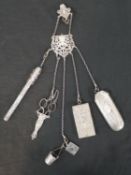 A Victorian and later silver and silver plate chatelaine with six attachments, including a silver