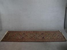 A biscuit ground hand made Erevan Russian runner. W.303 D.82cm