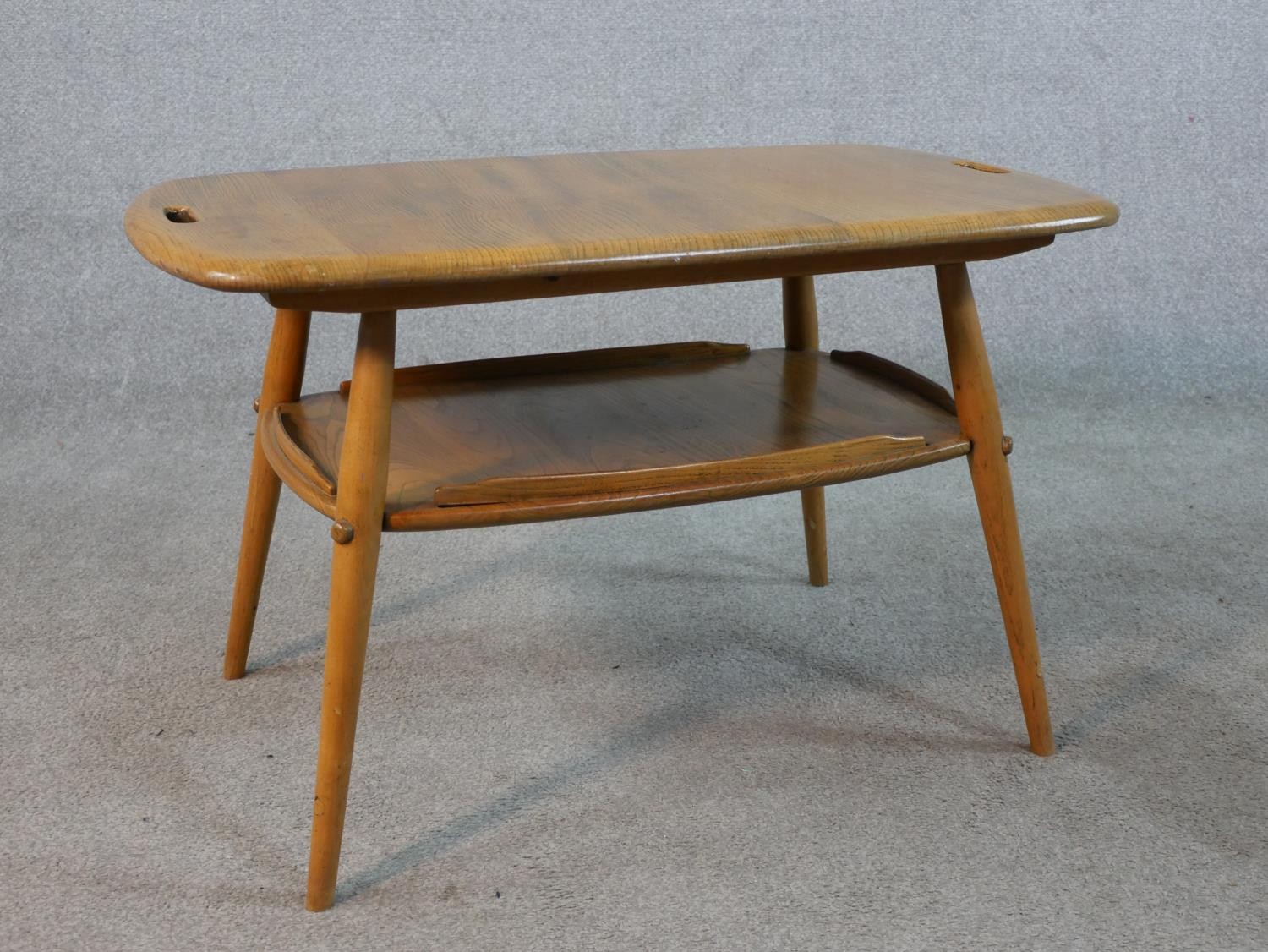 A 20th century blonde elm and beech Ercol two tier occasional tray table, model number 457, raised - Image 3 of 5