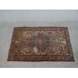 A cream ground hand made Persian Hamadan rug. W.156 D.98cm