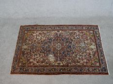 A cream ground hand made Persian Hamadan rug. W.156 D.98cm