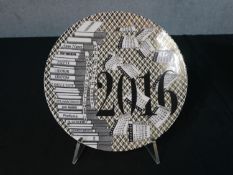 A limited edition Fornasetti Italian porcelain year plate for 2016, Piatto Calendario 220/700, in