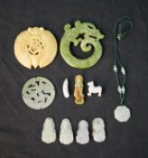 Assorted carved Chinese jade items to include a pendant, translucent jade roundel, a jade dragon