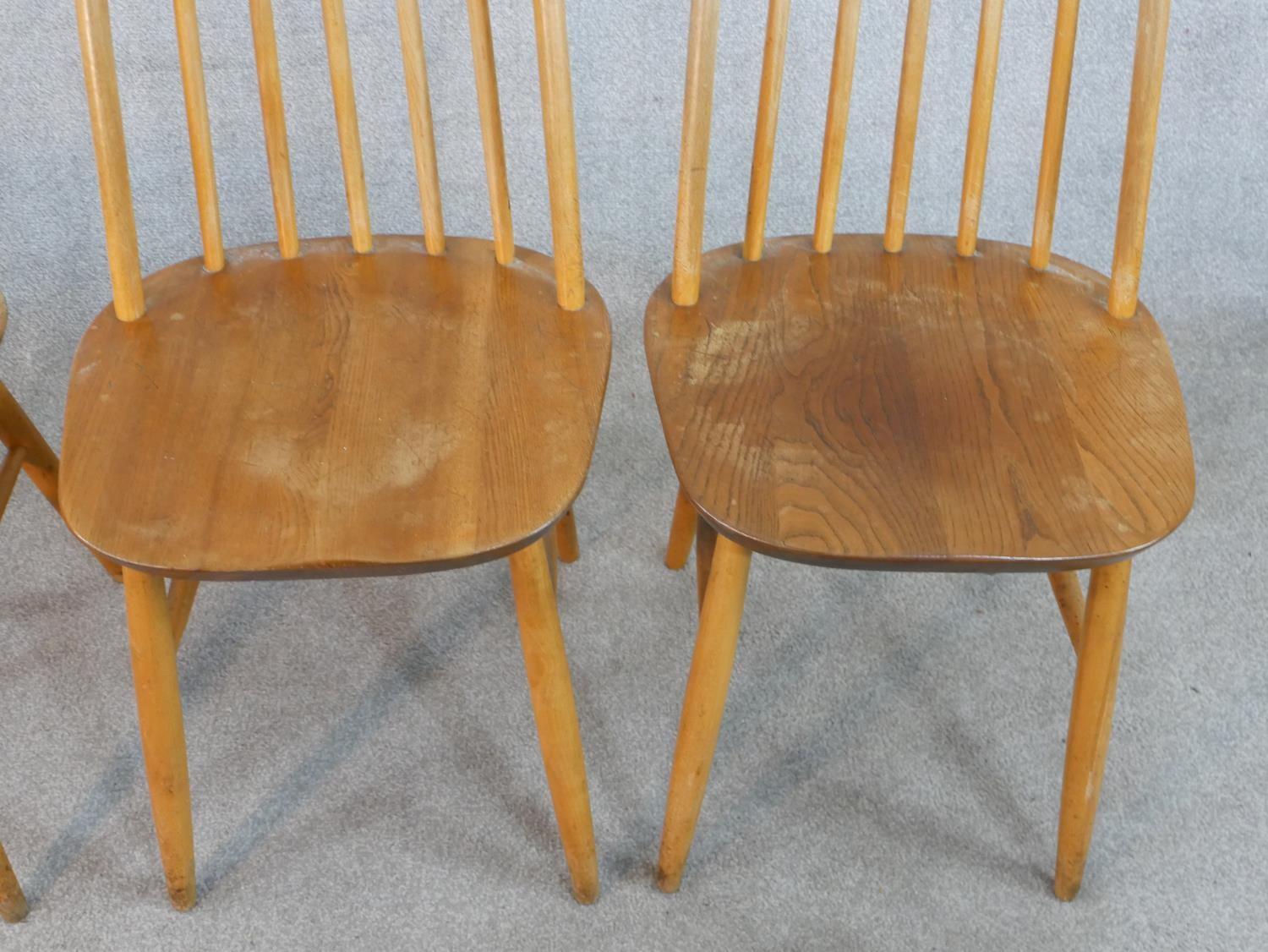 A set of four 20th century Ercol style blond elm hoop back Windsor dining chairs. - Image 3 of 6