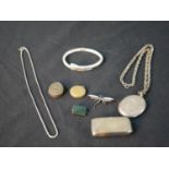 A collection of silver and jewellery, including a silver oval locket and chain, a silver,