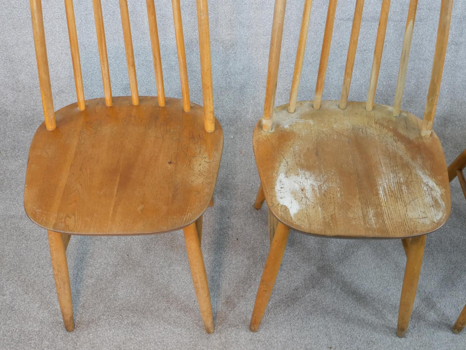 A set of four 20th century Ercol style blond elm hoop back Windsor dining chairs. - Image 2 of 6