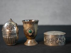 An Indian silver / white metal oval box and cover decorated with Gods, together with an Indian white