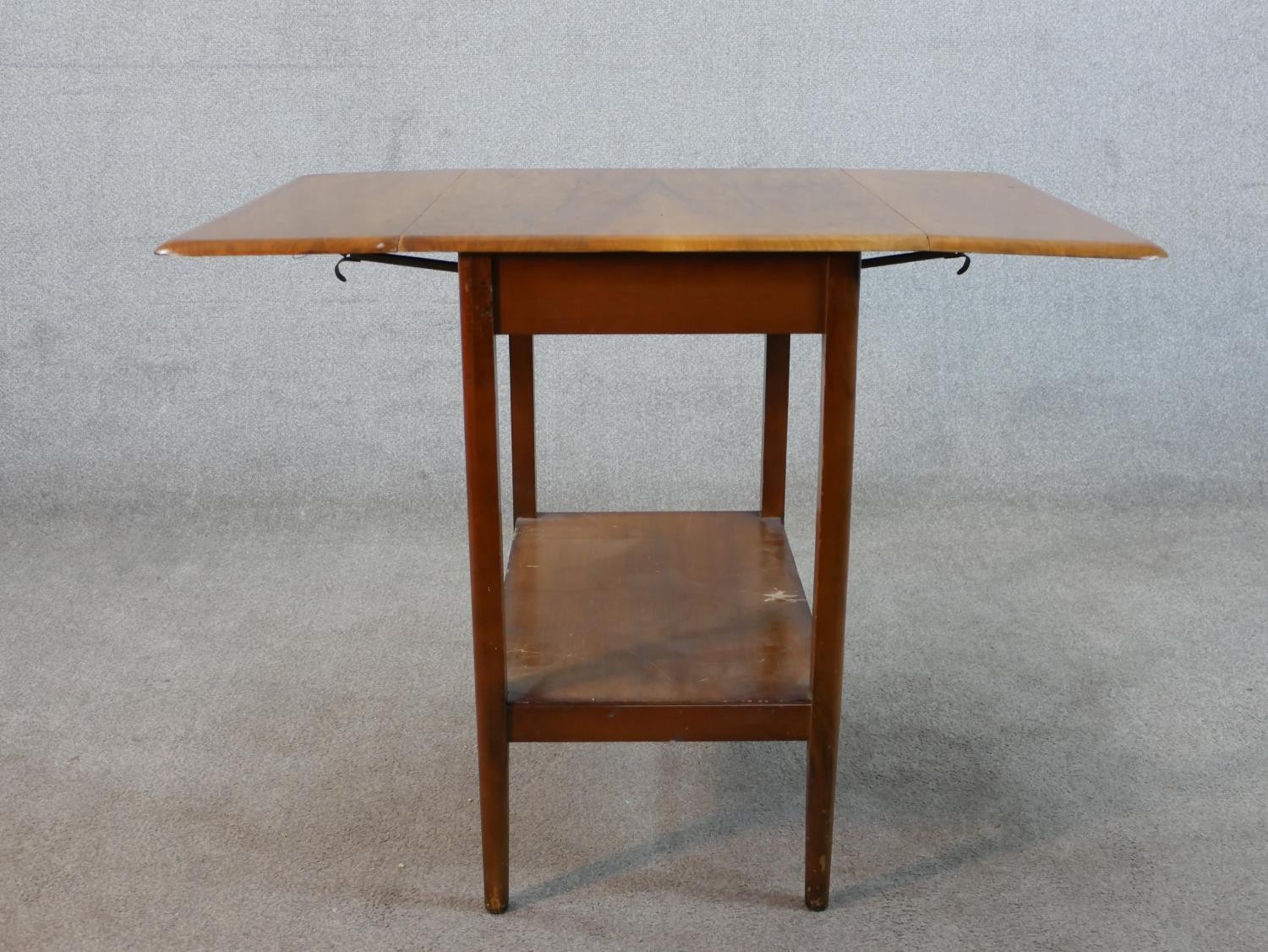 A mid 20th century mahogany drop leaf table with shelf undertier raised on square tapering - Image 4 of 6