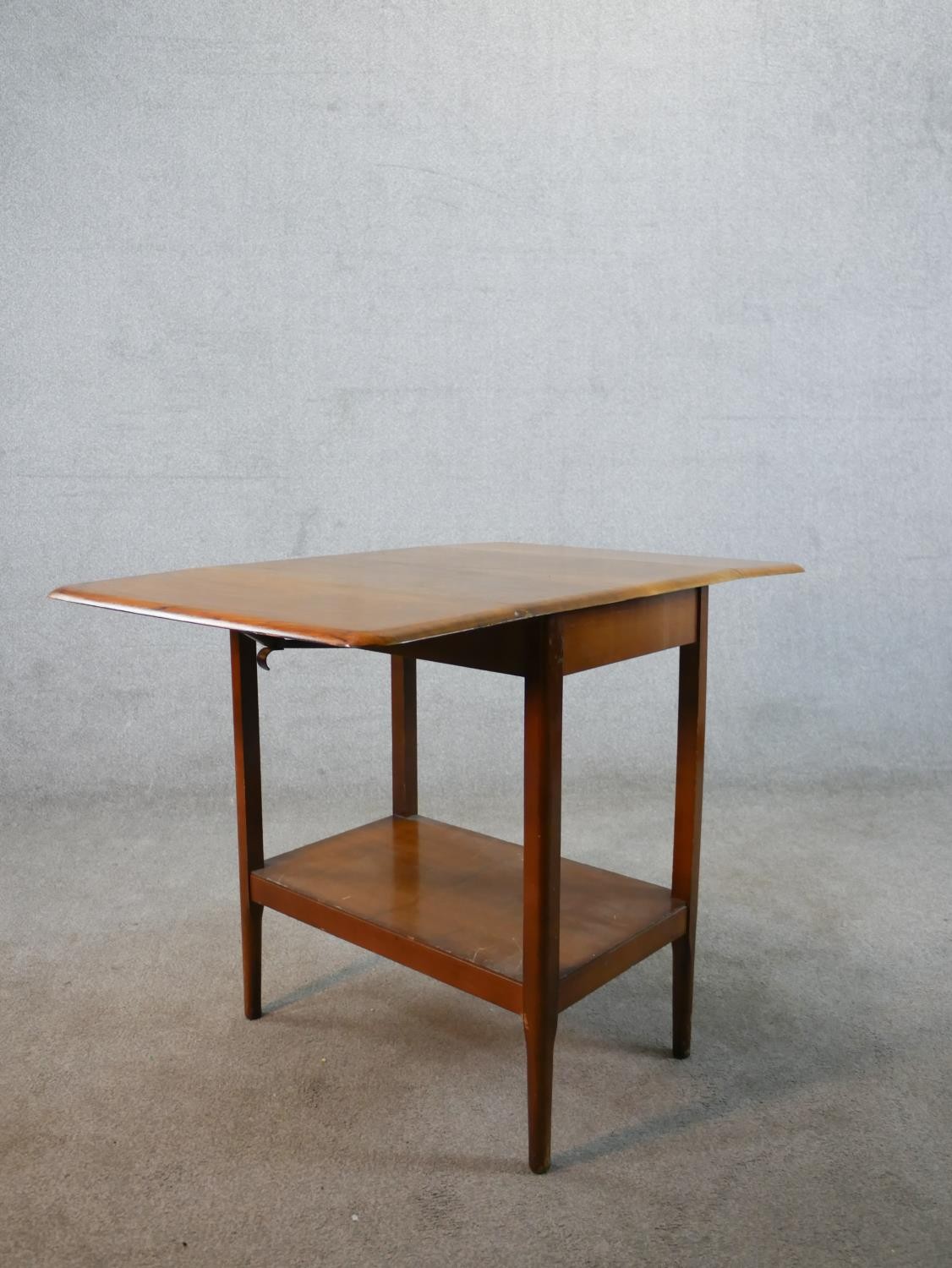 A mid 20th century mahogany drop leaf table with shelf undertier raised on square tapering - Image 6 of 6